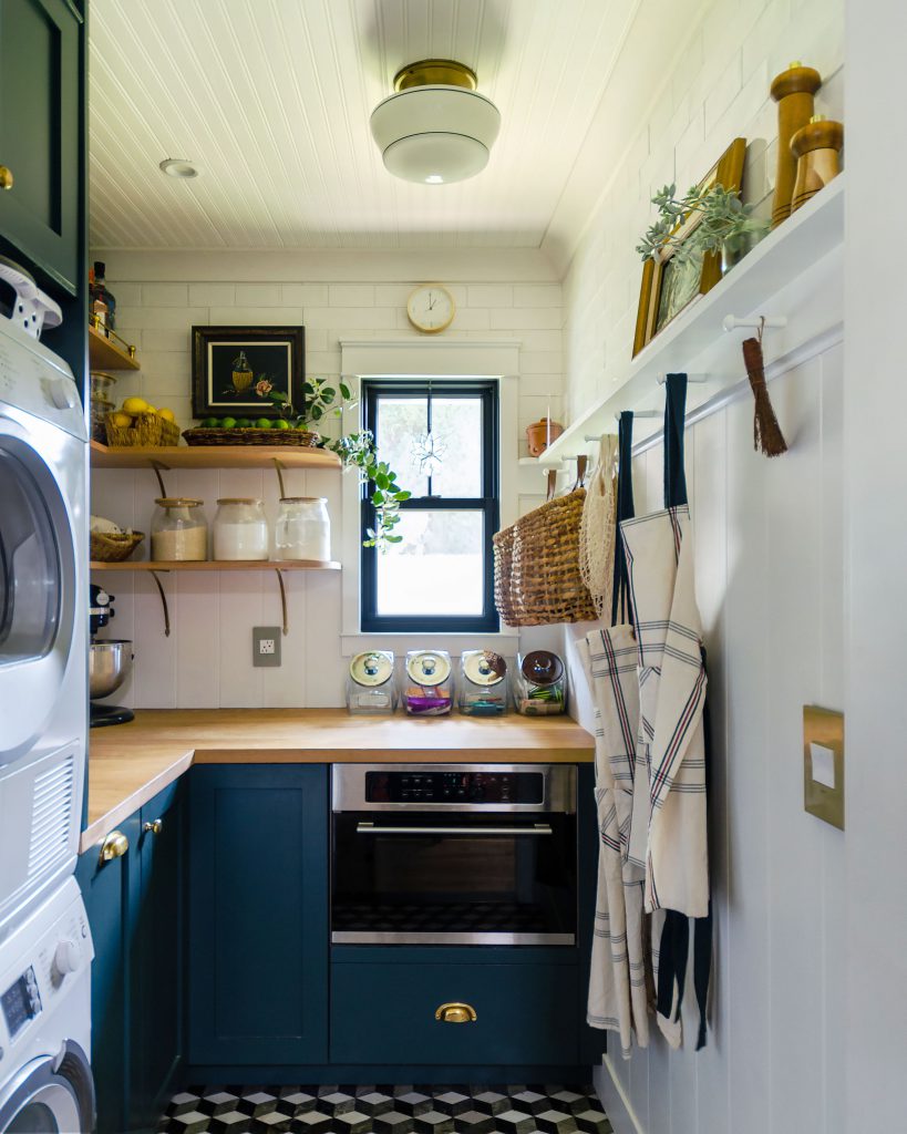 a pantry with a washer and dryer