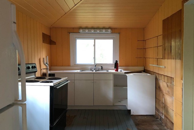 The original kitchen's dark yellow paint and checkerboard floors were colorful, but didn't match the light and minimal aesthetic they were after.