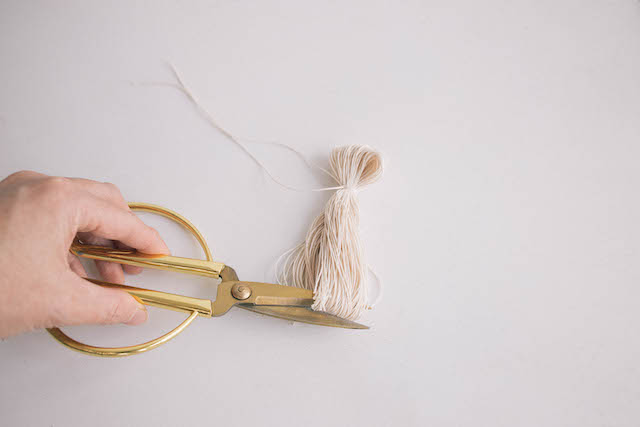 Cut the bottom of the looped thread to create a fringe bottom. Trim to even the ends out.