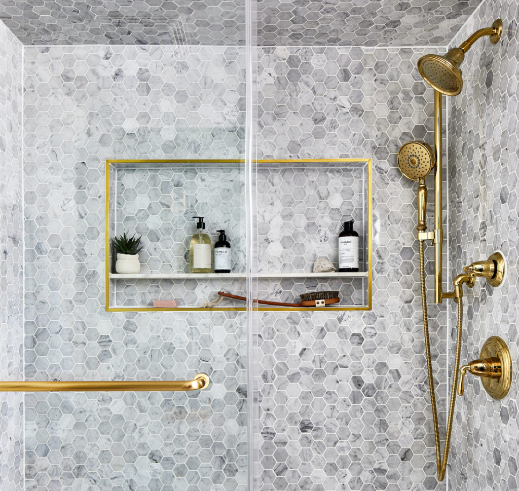 the gray tiled shower, from floor to ceiling