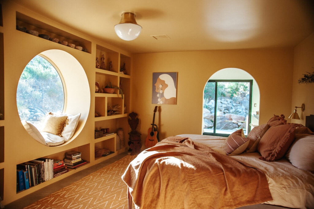 Yellow bedroom with round window nook