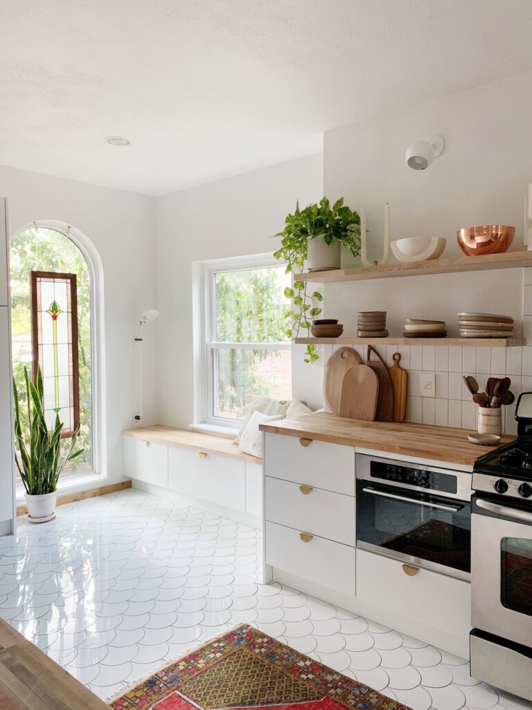 Arched window in white kitchen