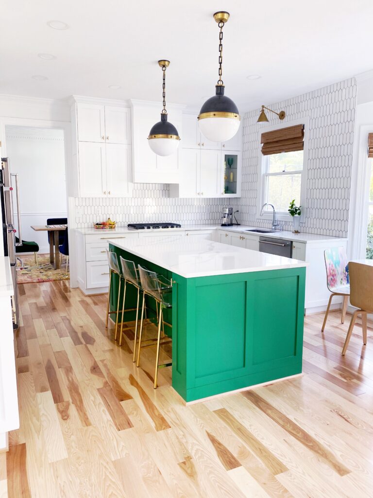 Green and white two-tone kitchen cabinets