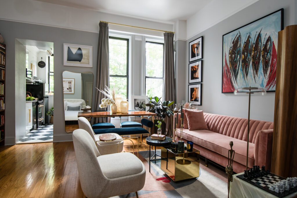 Studio apartment with pink velvet sofa