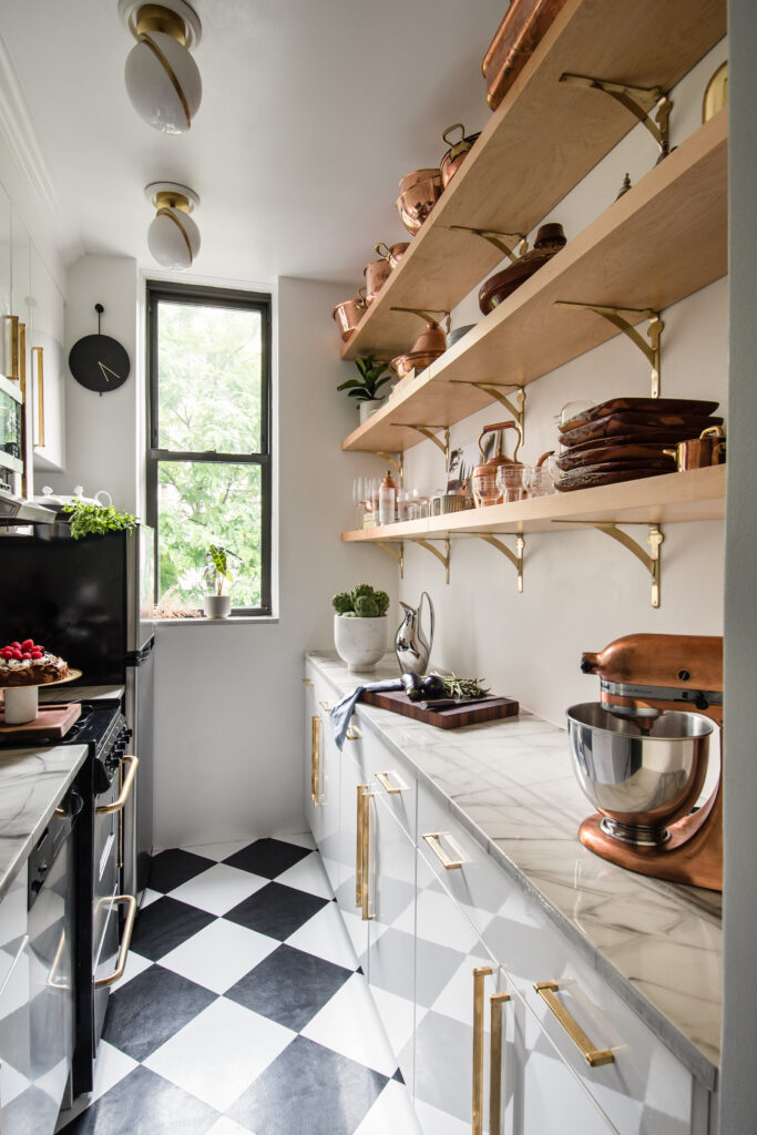Galley kitchen with checkered floors and open shelving