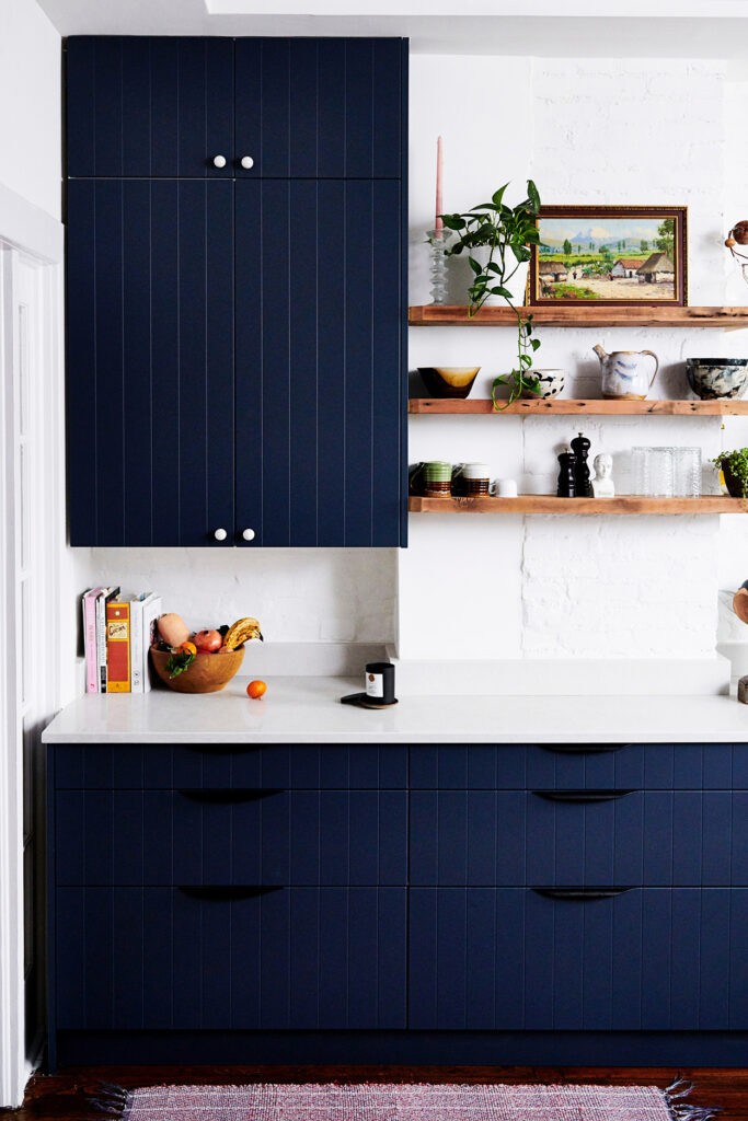 Semihandmade navy beaded kitchen cabinets
