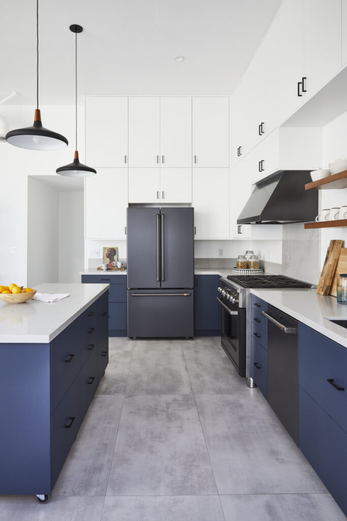 Matte black appliances in navy and white kitchen