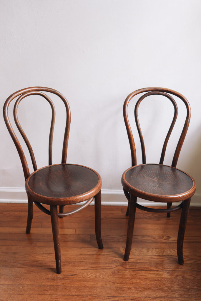 Dark curved wood chairs