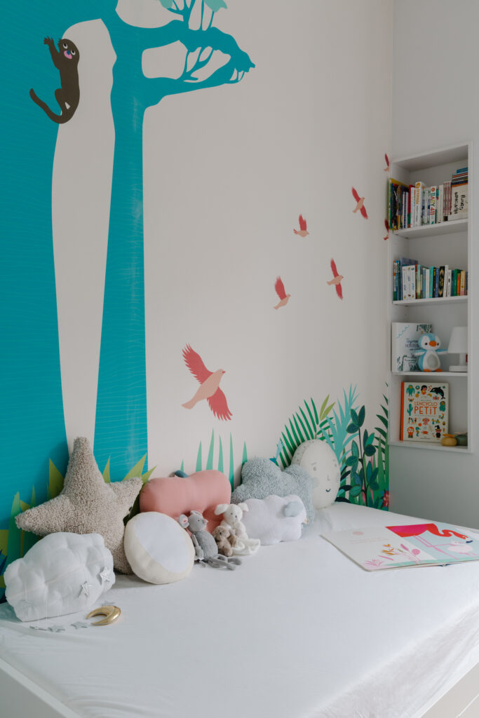 Kids bedroom with art decals on the walls