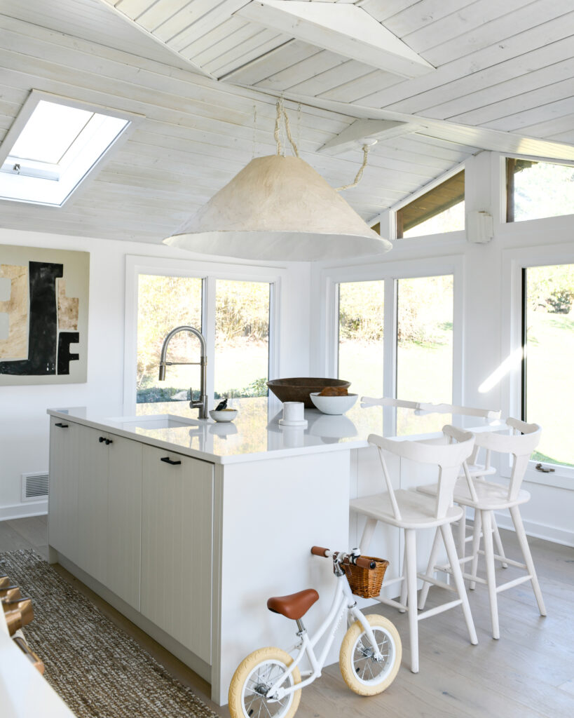 White kitchen with white island