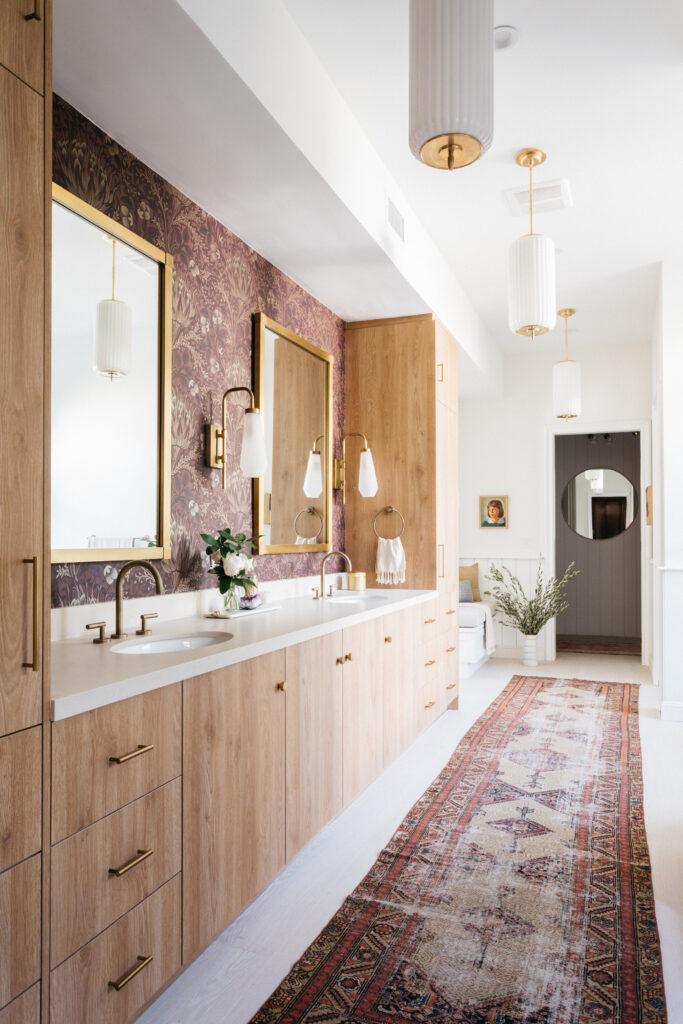 Mauve bathroom with wood bathroom vanity