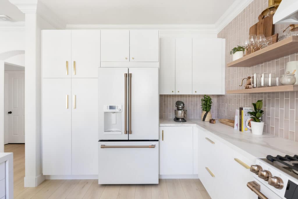 Wall of white kitchen cabinet storage