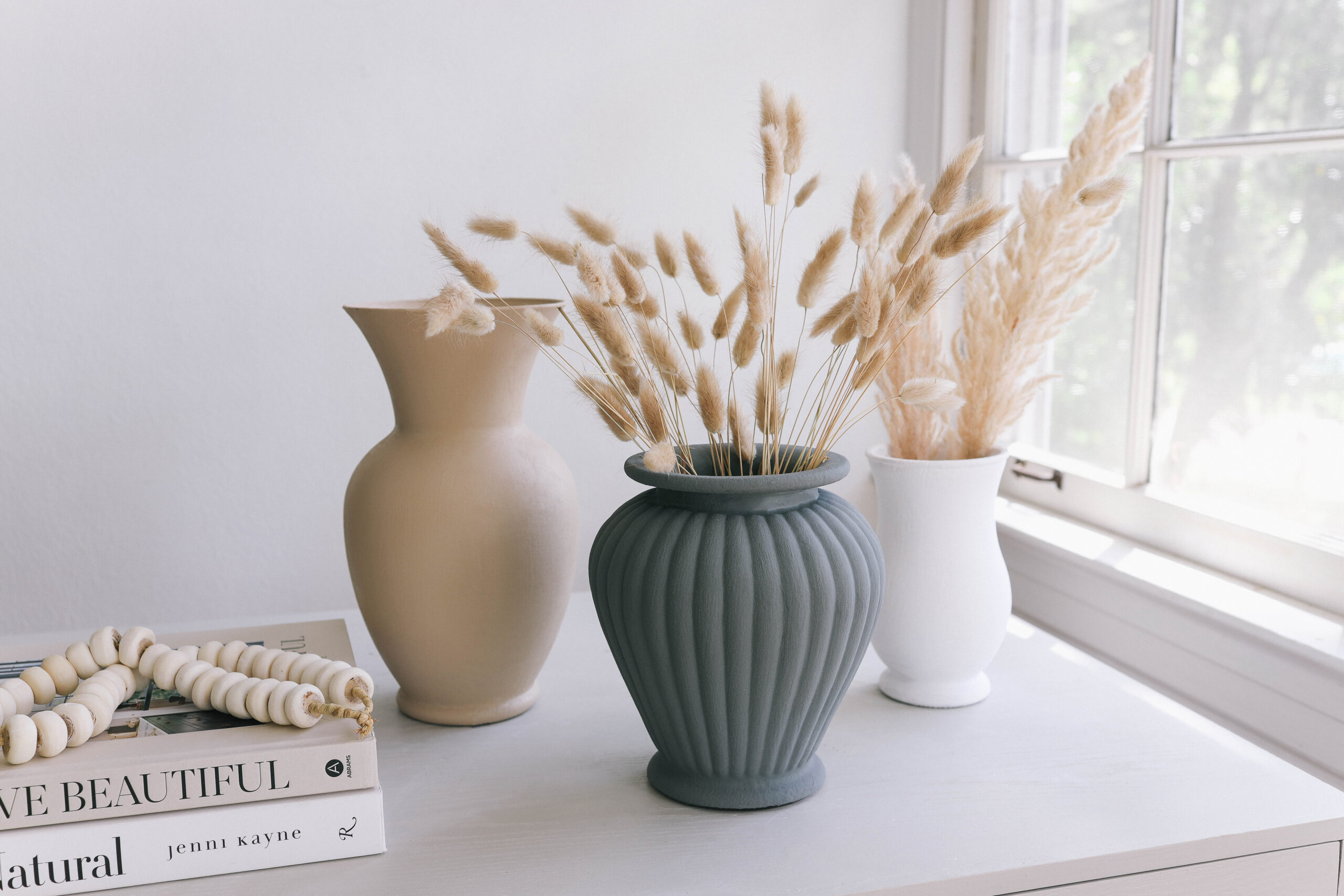 Neutral painted vases with dried florals