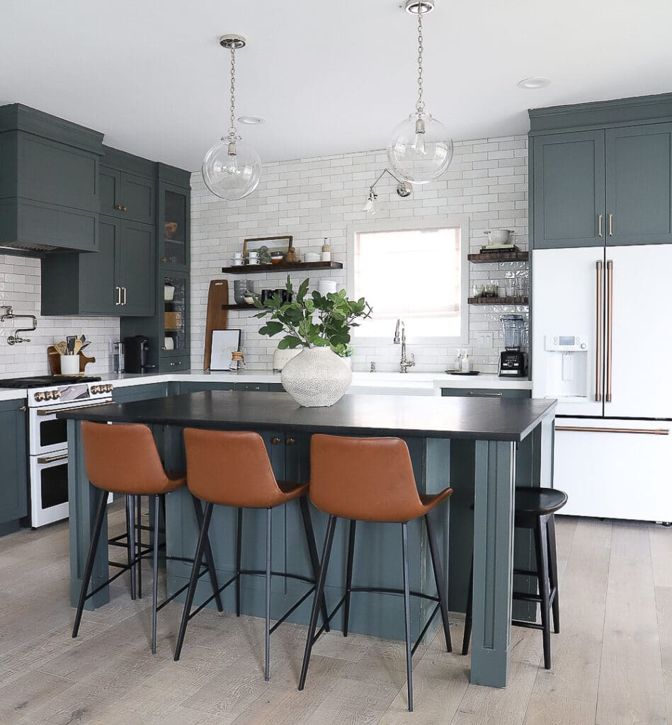 Dark gray kitchen with leather bar stools