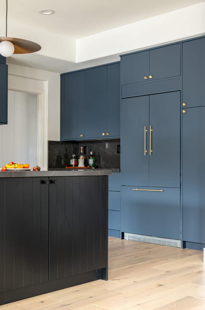 Navy kitchen cabinets and black island