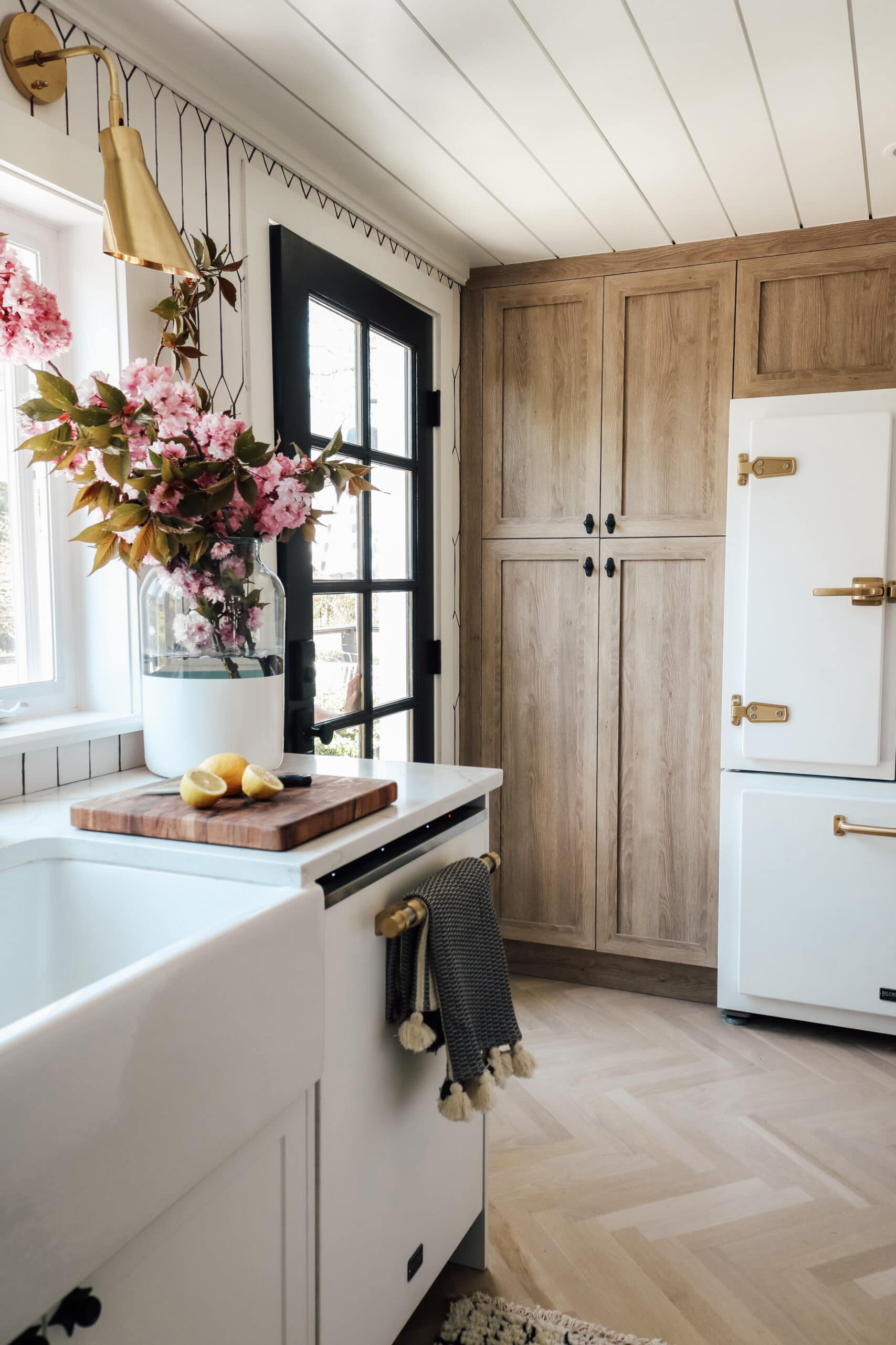 White fridge with wood like kitchen cabinets