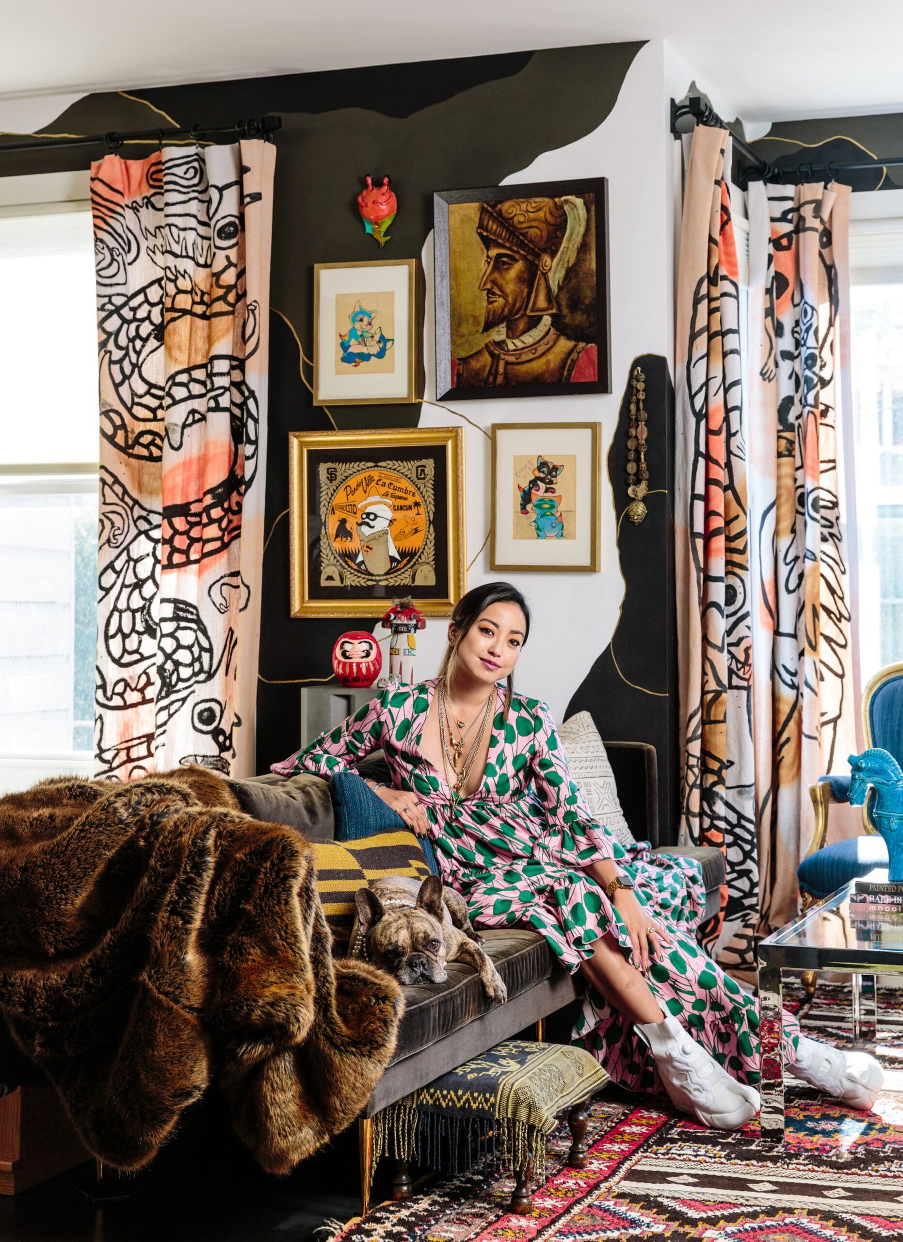 Designer Noz Nozawa in a colorful print filled living space