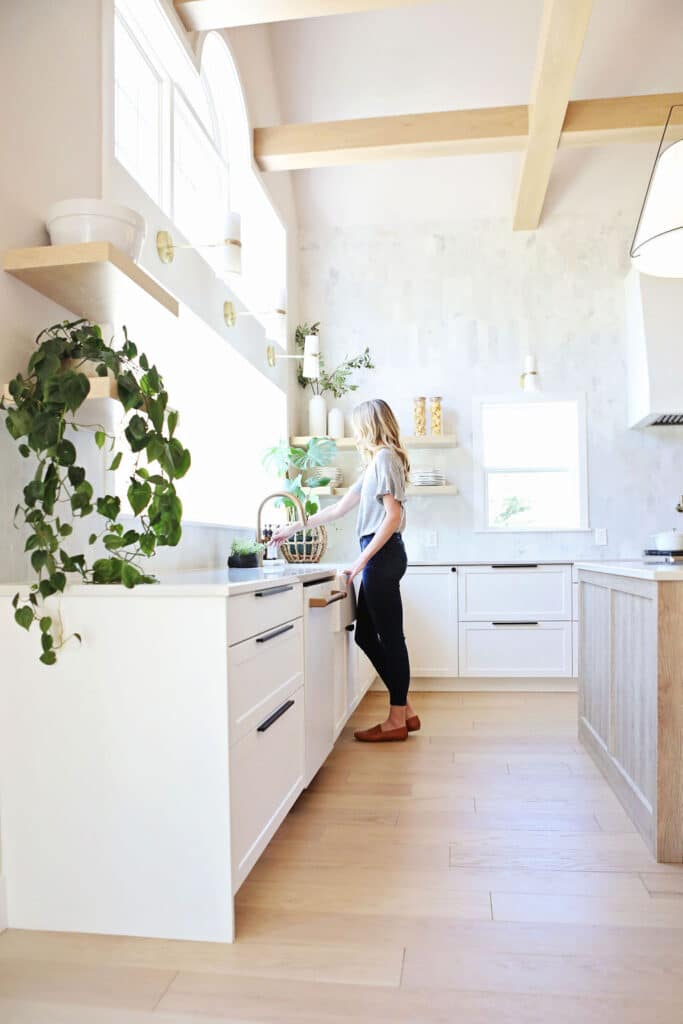 White kitchen cabinets sink view