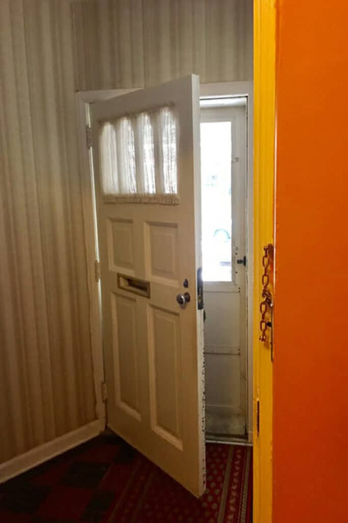 Orange painted entryway before look