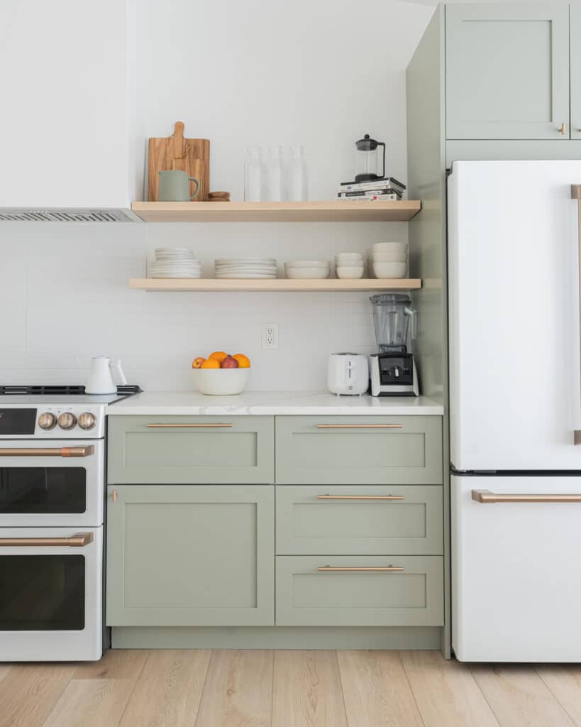 Sage cabinets with white appliances