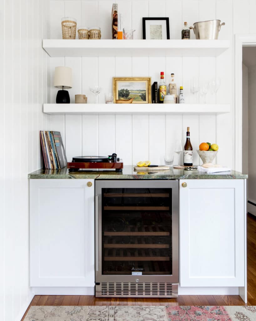 Built in home bar with a beverage refrigerator