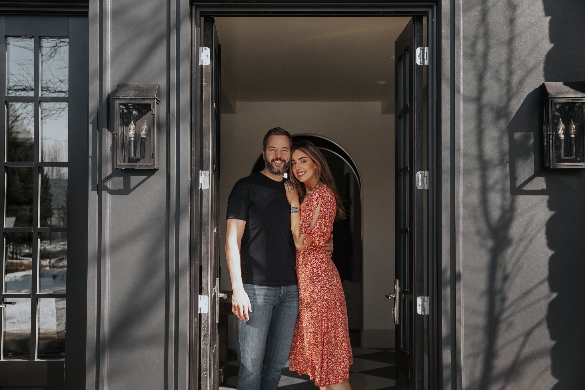 Chris and Julia Marcum post in an open doorway