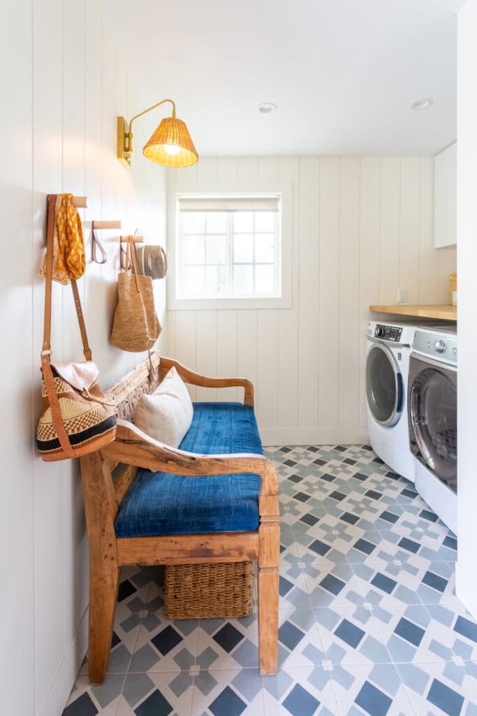 Mudroom makeover with blue tile and a washer dryer