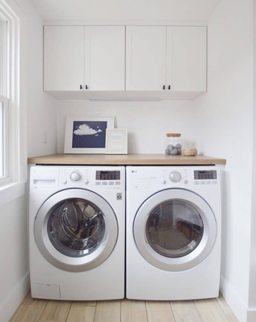 Small white laundry room setup