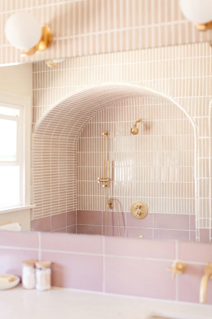 Arched pink and white bathroom